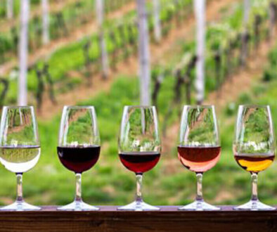 Wine glasses with winery in background